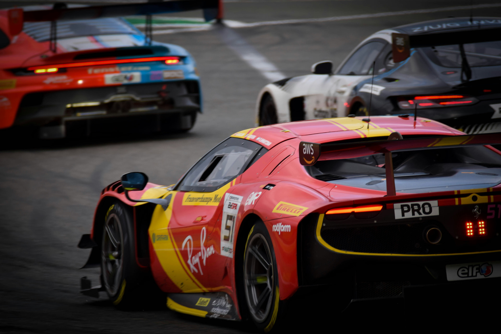 GT race cars battling through a race weekend